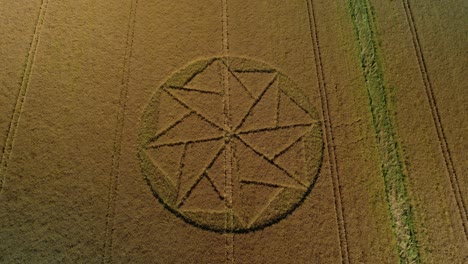 Mysterious-crop-circle-aerial-lowering-tilt-up-view-Stanton-St-Bernard-Wiltshire-countryside