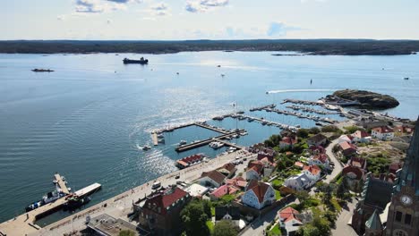 Lysekil-North-Harbor-With-Boats-And-Barge-Cruising-At-Calm-Waters-Of-Skagerrak-Strait-In-Sweden