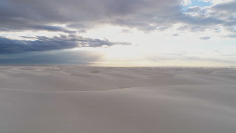 4K-aerial-of-beautiful-endless-white-sand-dune-field-with-people-for-scale