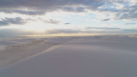 4K-aerial-moving-over-stunning-vast-white-sand-dune-desert-at-sunrise