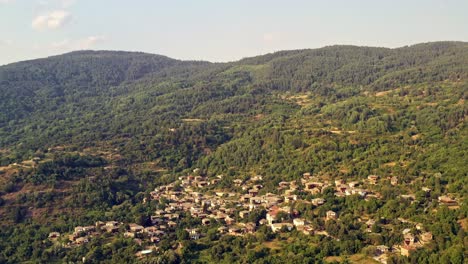 Aerial-flight-over-old-isolated-mountain-village-houses-of-Kovachevitsa-Rhodopes-Bulgaria