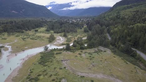 Rising-tidal-flat-aerial-reveals-town-of-Bella-Coola-in-distant-valley