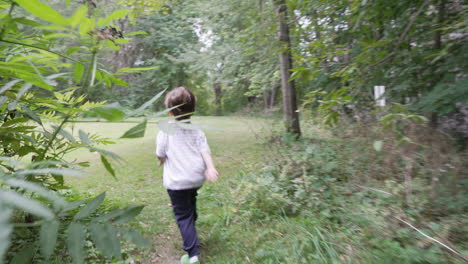 Child-running-in-woods