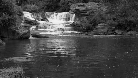 Tanner-Falls-in-northern-Pennsylvania-as-seen-from-below-in-the-summer-time-in-black-and-white