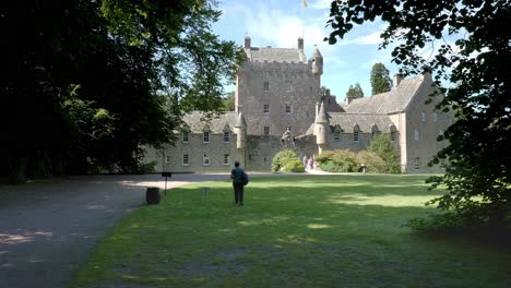 Lady-walks-towards-Cawdor-Castle