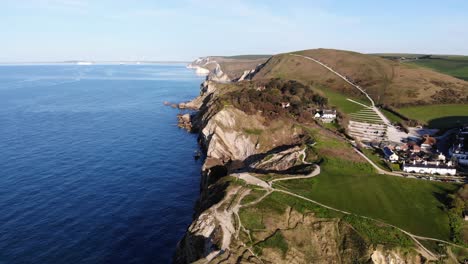 Aerial-forward-shot-of-Stair-Hole-at-Lulworth-Cove-Dorset-England-on-a-beautiful-morning