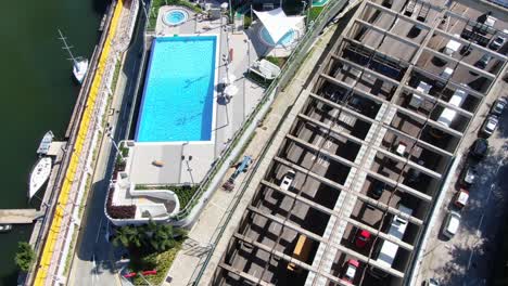 Hong-Kong-harbour-tunnel-and-police-officer-club-swimming-pool,-Aerial-view