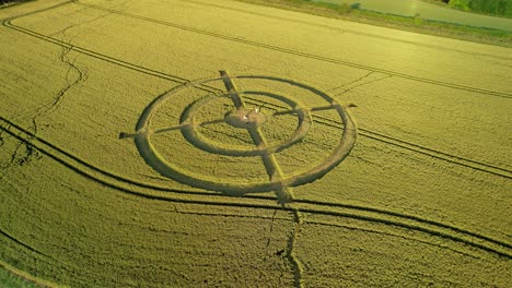 Hackpen-hill-strange-crop-circle-symbols-in-rural-grass-farming-meadow-aerial-view-left-orbit-above-harvest