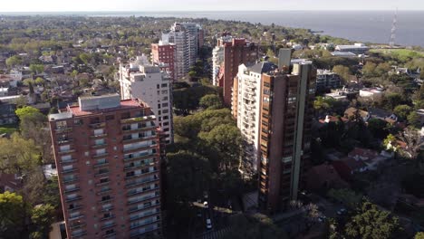 Aerial-flyover-skyscraper-apartments-in-Vicente-Lopez-District-and-River-Plate-in-background---Buenos-Aires,Argentina