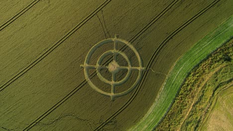 Hackpen-hill-strange-crop-circle-target-pattern-in-rural-grass-farming-meadow-aerial-view-descending-above-harvest