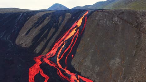 Hot-Molten-Lava-Flowing-From-Fagradalsfjall-Volcano-In-Iceland---aerial-shot