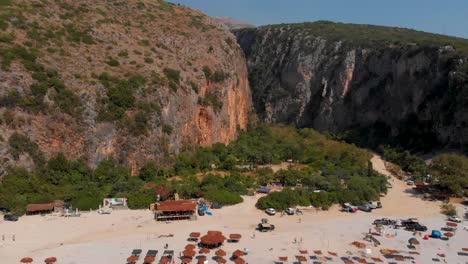 Tilt-up-over-beautiful-beach-and-Gjipe-canyon-in-Albania