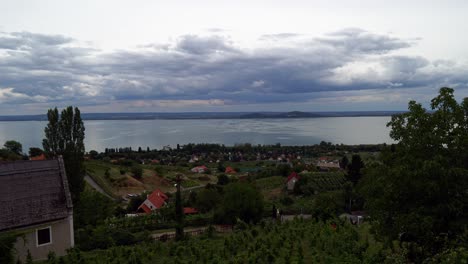 Stunning-timelapse-video-from-Hungary,-Badacsony-hillside,-showing-the-landscape,-grapevines-and-the-Lake-Balaton-in-a-windy-weather