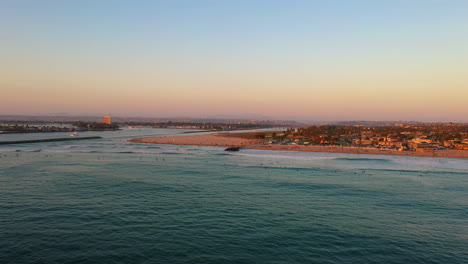 Ocean-beach-dog-beach-in-San-Diego-California-at-sunset,-aerial-with-copy-space