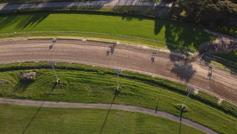 Aerial-top-down-shot-of-warm-up-round-during-horse-race-competition-in-San-Isidro,Argentina