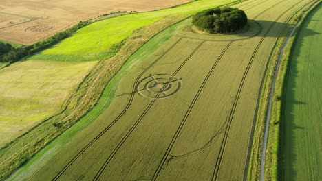 Hackpen-hill-strange-crop-circle-target-pattern-in-rural-grass-farming-meadow-aerial-view-over-countryside-landscape