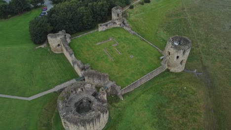 Flint-castle-Welsh-medieval-coastal-military-fortress-ruin-aerial-view-rising-top-down-shot