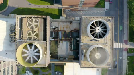 Top-Down-Aerial-View-Looking-Down-Air-Conditioning-Unit-Fans-on-Rooftop