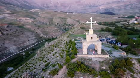 Man-Visit-The-Ancient-Cedars-Cross-In-Bsharri-With-Kadisha-Valley-In-Lebanon