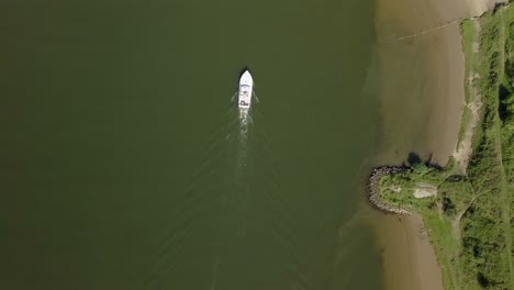 Aerial-drone-view-of-top-down-shot-over-the-boat-at-the-river-in-Europe