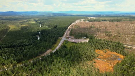 Aerial-View-Of-Country-Road-Between-Green-Forest-In-Sälen,-Dalarna,-Sweden---drone-shot