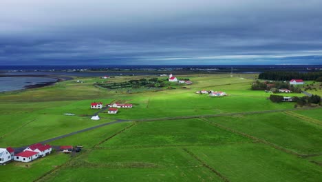 Distant-View-Of-Gardakirkjugardur-Cemetery-And-Gardakirkja-Church-In-Gardabaer,-Southwest-Iceland