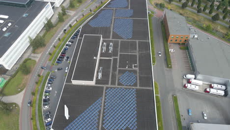 Aerial-over-large-warehouse-with-solar-panels-on-rooftop
