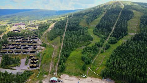 Aerial-View-Of-Ski-Lodge-And-Stoten-Ski-Resort-During-Summer-With-Lush-Green-Trees-In-Salen,-Sweden