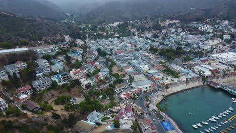 Aerial-View-of-Hillside-Villas-Avalon-Bay-Town-Beach-at-Dusk,-Santa-Catalina,-California