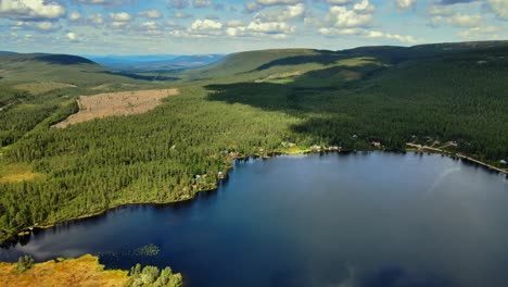 Aerial-View-Of-Lake-With-Lush-Green-Forest-In-Salen,-Dalarna,-Sweden