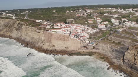 Atlantic-ocean-waves-washing-rocks-and-cliffs,-Azenhas-do-Mar-beach,-Portugal