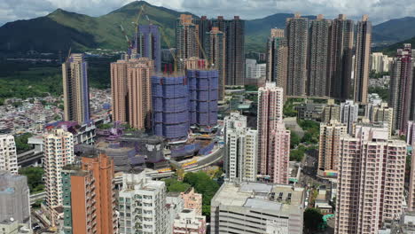 Aerial-flyover-dense-high-rise-residential-buildings-in-Yuen-Long,-Hong-Kong