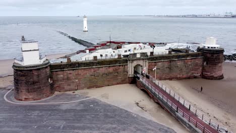 Fort-Perch-Rock-New-Brighton-sandstone-coastal-defence-battery-museum-aerial-view-left-parallax-lighthouse-shot