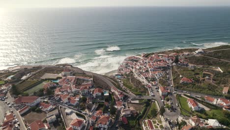 Luxury-town-of-Azenhas-Do-Mar-in-high-angle-drone-view-with-ocean-water-in-front