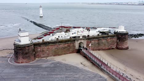 Fort-Perch-Rock-New-Brighton-sandstone-coastal-defence-battery-museum-and-lighthouse-aerial-view-right-to-Peel-port