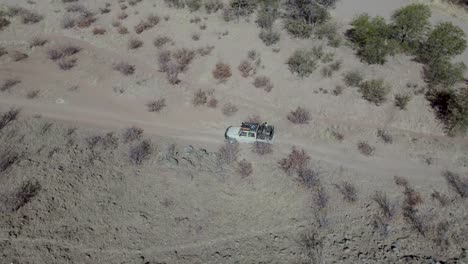 Off-road-car-driving-through-Namibia-territory-during-safari,-Africa