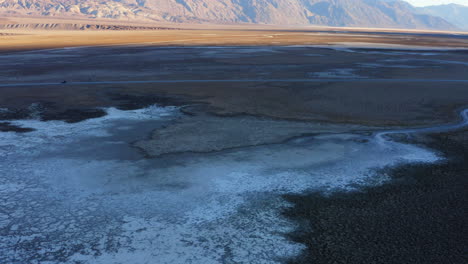 Badwater-basin-of-Death-Valley-National-Park-during-daylight,-covered-with-thick-layer-of-salt-pans