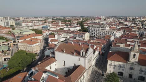 Majestic-cityscape-and-rooftops-of-Aveiro-in-Portugal,-aerial-orbit-view