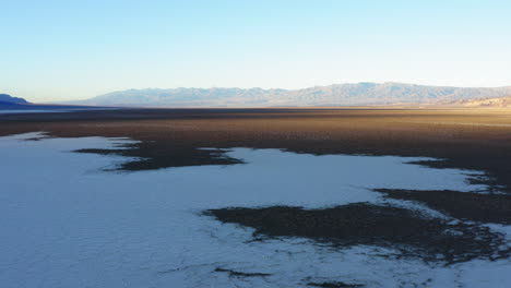 Birds-eye-view-of-Badwater-basin-at-Death-Valley-National-Park,-covered-with-thick-layer-of-salt-pan