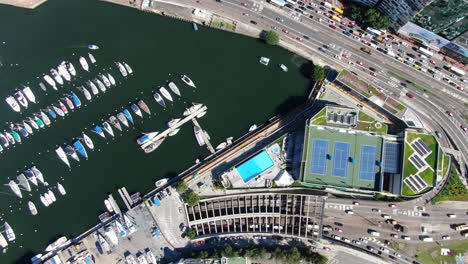 Hong-Kong-Hafentunnel-Und-Schwimmbad-Des-Polizistenclubs,-Luftaufnahme