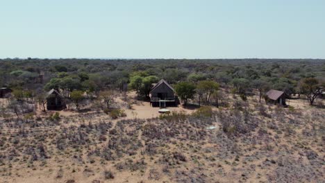 Campsite-Hut-Village-in-Beautiful-African-Landscape-in-Namibia,-Aerial