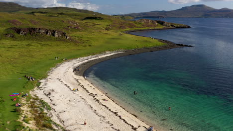 Cinematic-drone-shot-of-Coral-Beach-in-Claigan-with-white-sandy-beaches-and-tropical-blue-water,-just-north-of-Dunvegan-Scotland