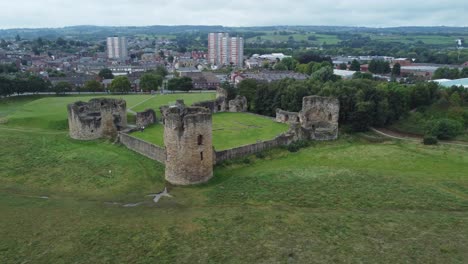 Flint-castle-Welsh-medieval-coastal-military-fortress-ruin-aerial-view-wide-rotation-left