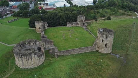 Flint-castle-Welsh-medieval-coastal-military-fortress-ruin-aerial-view-high-orbit-left