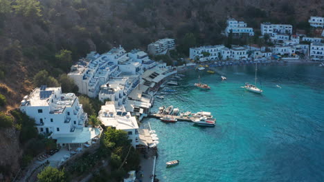 Boats-And-The-Scenic-Village-Of-Loutro-In-Crete,-Greece---aerial-drone-shot