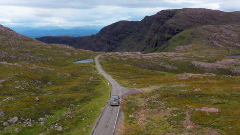 Drone-shot-of-Bealach-Na-Ba-Applecross-road-through-the-mountains-of-the-Applecross-peninsula,-in-Wester-Ross-in-the-Scottish-Highlands