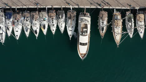 Yachts-Parked-In-Pier-Of-Poros-Island-In-Greece---aerial-shot