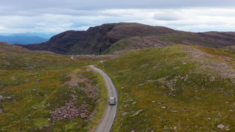 Cinematic-drone-shot-of-Bealach-Na-Ba-Applecross-road-through-the-mountains-of-the-Applecross-peninsula,-in-Wester-Ross-in-the-Scottish-Highlands