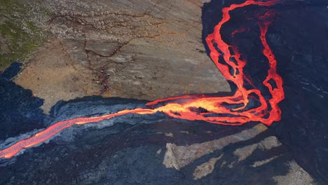 River-Of-Lava-Flowing-Down-During-Volcano-Eruption,-Fagradalsfjall,-Southwest-Iceland---aerial-drone-shot