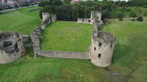 Flint-castle-Welsh-medieval-coastal-military-fortress-ruin-aerial-view-birdseye-descending